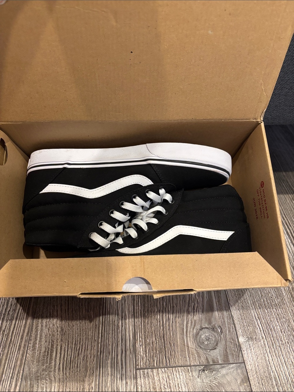 Vans Black and White High-Top Skate Sneakers
